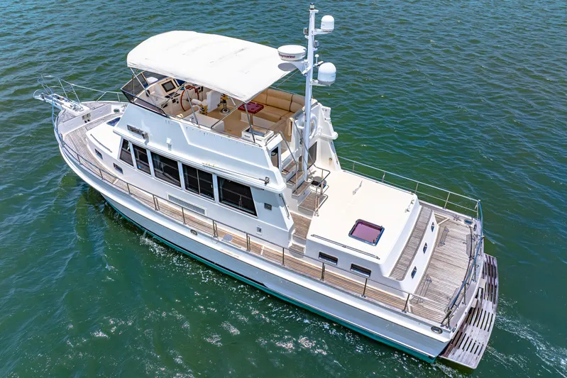 Grazie Yacht Photos Pics 2008 Grand Banks 47 Classic yacht cruising on open water, aerial view.