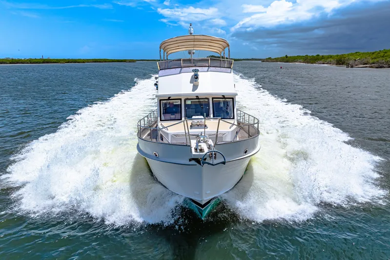 Grazie Yacht Photos Pics 2008 Grand Banks 47 Classic yacht cruising on open water.