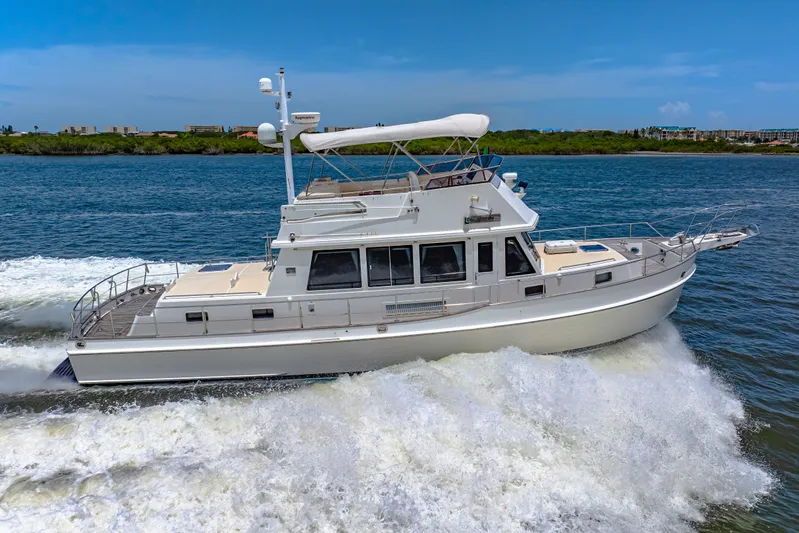 Grazie Yacht Photos Pics 2008 Grand Banks 47 Classic yacht cruising on open water.