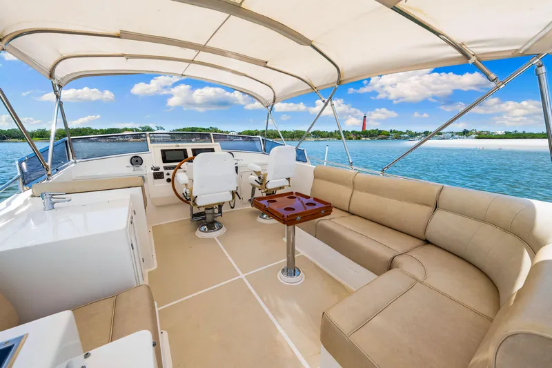 Grazie Yacht Photos Pics 2008 Grand Banks 47 Classic yacht interior with seating, helm, and ocean view.