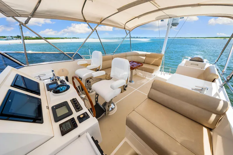 Grazie Yacht Photos Pics Luxurious 2008 Grand Banks 47 Classic yacht interior with helm, seating, and ocean view.