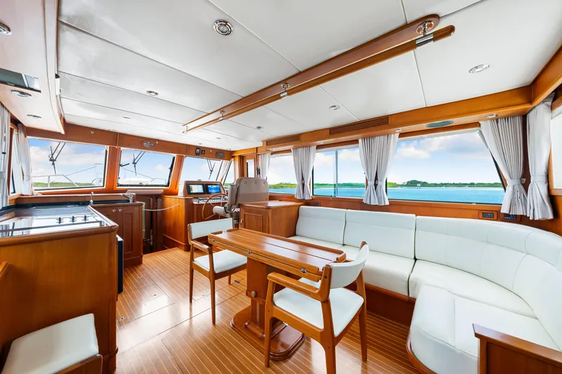 Grazie Yacht Photos Pics Interior of 2008 Grand Banks 47 Classic yacht with elegant wood finish and panoramic windows.