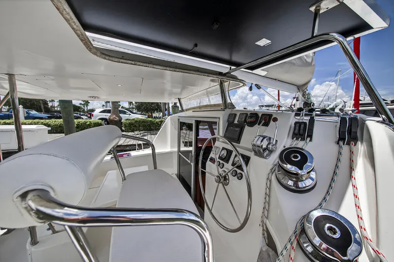 Cocoa Bella Yacht Photos Pics Helm of 2011 Leopard 38 catamaran with steering wheel and navigation controls.