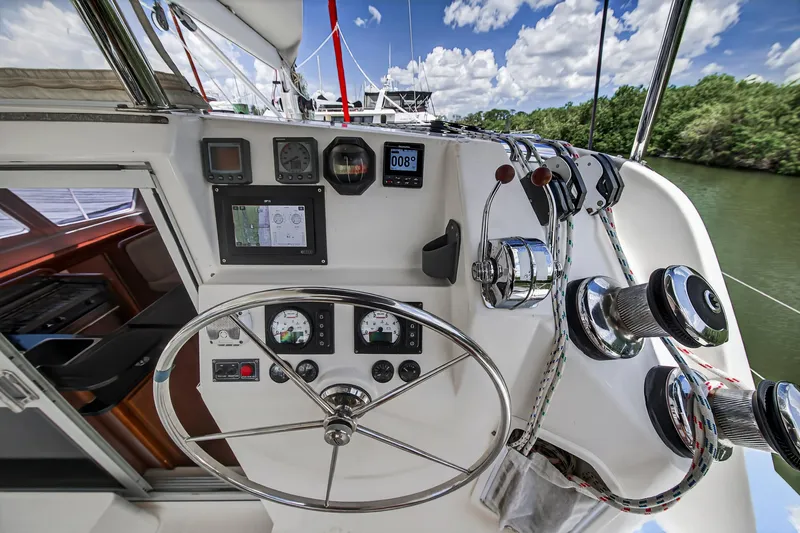 Cocoa Bella Yacht Photos Pics Helm of 2011 Leopard 38 catamaran with navigation instruments and steering wheel.