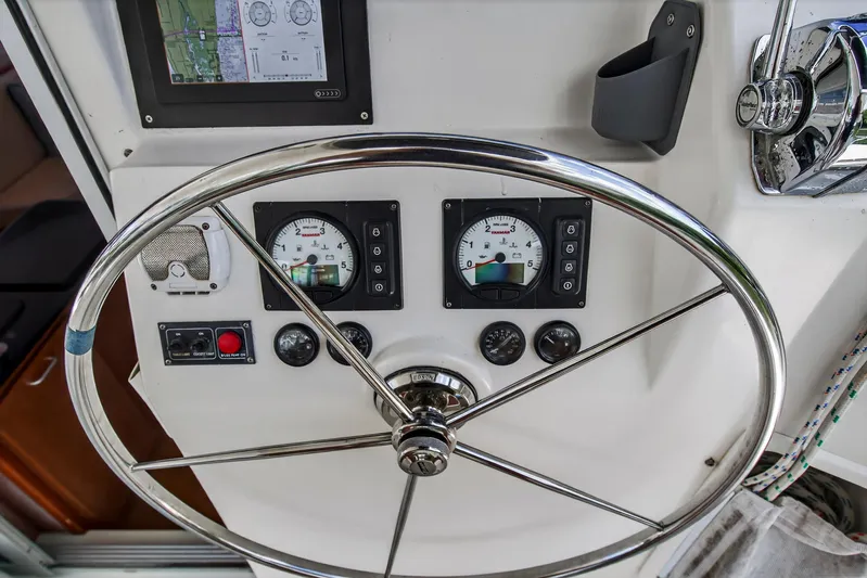 Cocoa Bella Yacht Photos Pics Steering wheel and gauges on a 2011 Leopard 38 yacht control panel.