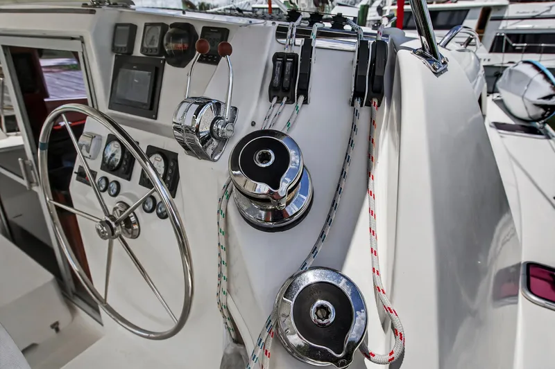 Cocoa Bella Yacht Photos Pics Steering and control panel of 2011 Leopard 38 catamaran with ropes and winches.