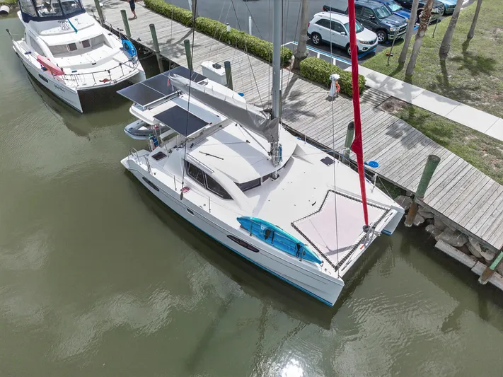 Cocoa Bella Yacht Photos Pics Aerial view of a 2011 Leopard 38 catamaran docked at a marina.