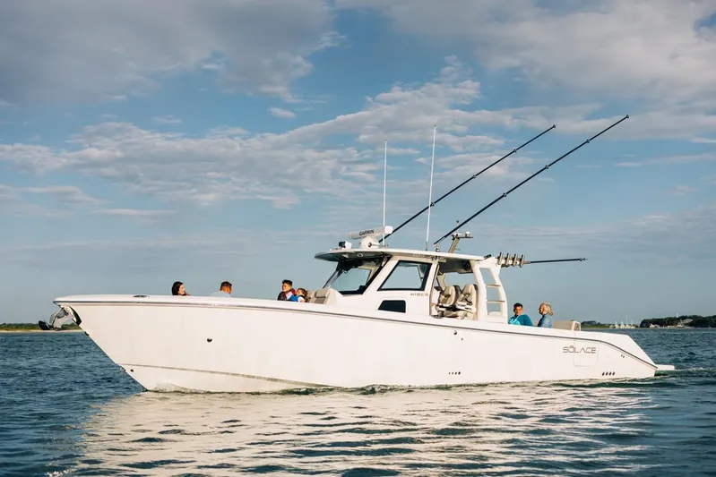 Game Changer Yacht Photos Pics 2022 Solace 415 CS boat cruising on calm water under a clear sky.