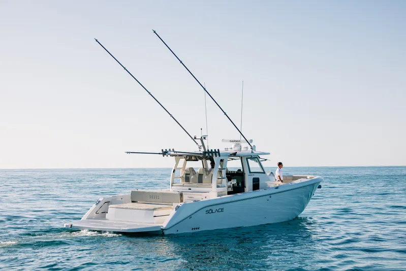 Game Changer Yacht Photos Pics 2022 Solace 415 CS boat cruising on open water under clear skies.