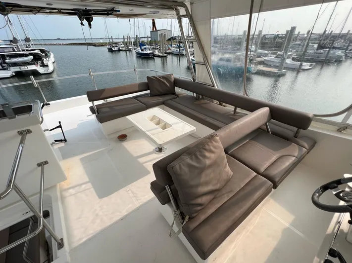  Yacht Photos Pics 2016 Leopard 51 Powercat with spacious deck and marina view.