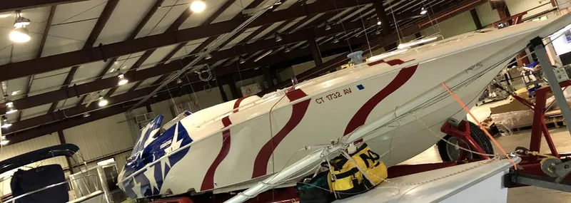  Yacht Photos Pics 1998 Fountain 42 Lightning boat with patriotic design in a storage facility.