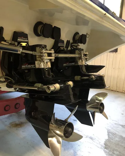  Yacht Photos Pics 1998 Fountain 42 Lightning boat with dual MerCruiser engines and propellers in a garage setting.