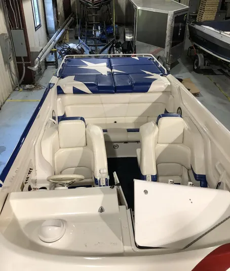  Yacht Photos Pics 1998 Fountain 42 Lightning boat interior with white seating and star-patterned upholstery.