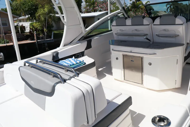  Yacht Photos Pics 2021 Chaparral 300 OSX boat interior with seating and storage, featuring modern design elements.