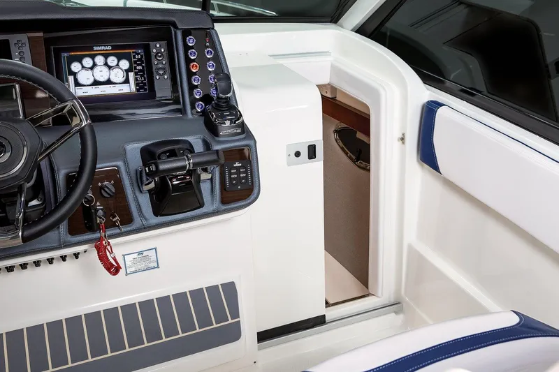  Yacht Photos Pics 2021 Chaparral 300 OSX boat cockpit with modern controls and navigation system.