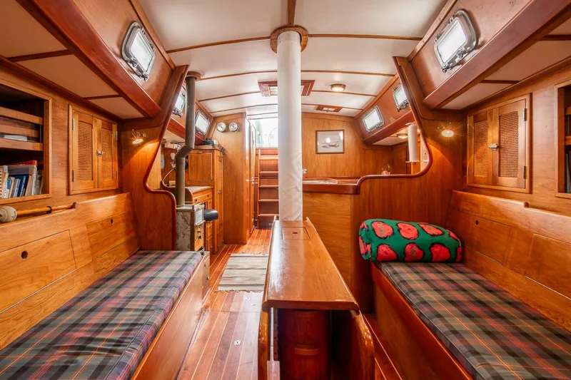 Aleyah Yacht Photos Pics Interior of 1984 Hank Hinckley OC42 sailboat with wooden furnishings and cozy seating.