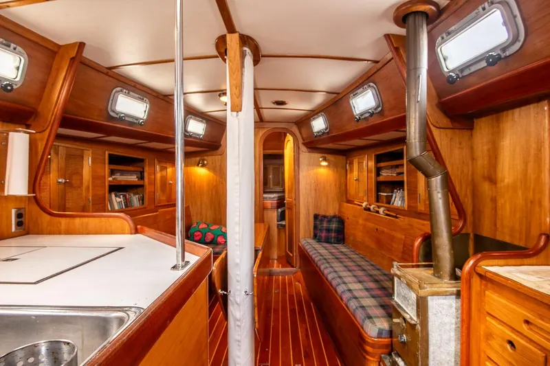 Aleyah Yacht Photos Pics Interior of 1984 Hank Hinckley OC42 sailboat with wood finish and cozy seating.