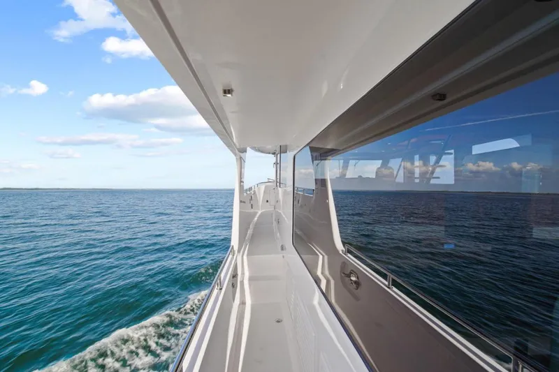 Daddy-o Yacht Photos Pics 2023 Outer Reef Yachts 670 Azure Custom Cockpit Motoryacht cruising on open sea.