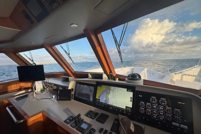 Daddy-o Yacht Photos Pics Cockpit view of 2023 Outer Reef Yachts 670 Azure Custom Motoryacht at sea.
