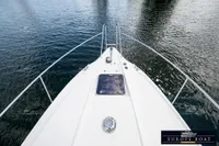 Bow view of 2000 Nimbus 310 Coupe on calm water.