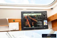 Navigation system on a 2000 Nimbus 310 Coupe boat, featuring a Simrad display.