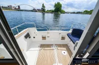 Nimbus 310 Coupe 2000 model, featuring a spacious deck with scenic water views.