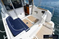 Nimbus 310 Coupe 2000 model boat with spacious deck and comfortable seating.