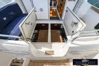 Open engine compartment on a 2000 Nimbus 310 Coupe boat, showcasing interior details.