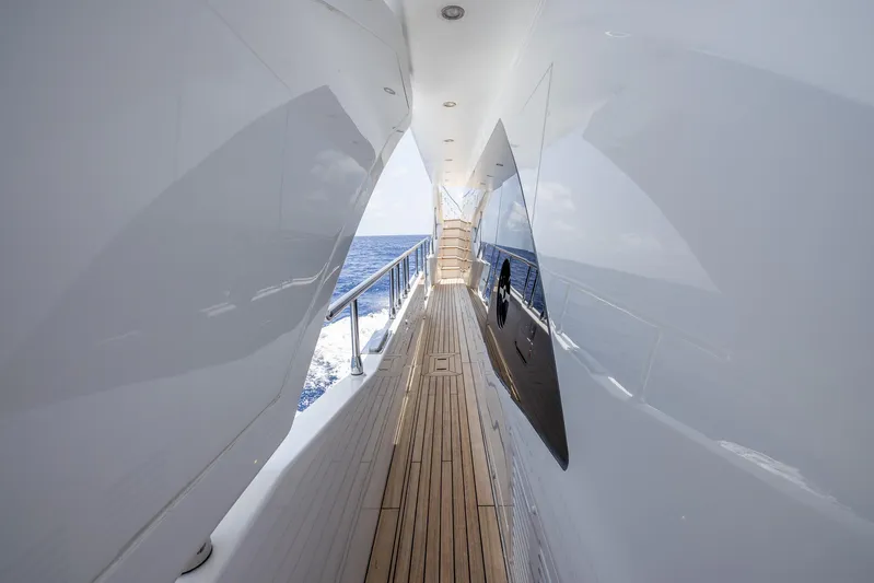 Captain Morgan II Yacht Photos Pics Side deck view of 2021 Azimut Grande 27 METRI yacht with ocean backdrop.