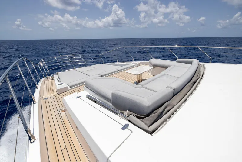 Captain Morgan II Yacht Photos Pics Luxurious Azimut Grande 27 METRI yacht deck with elegant seating, 2021 model, on open sea.