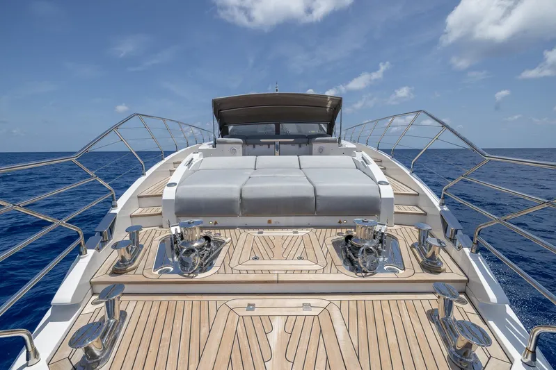 Captain Morgan II Yacht Photos Pics Luxurious Azimut Grande 27 METRI yacht deck with sun loungers, 2021 model, on open sea.
