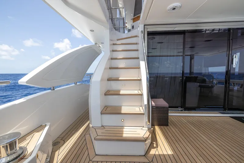 Captain Morgan II Yacht Photos Pics Luxurious Azimut Grande 27 METRI yacht staircase and deck, 2021 model, with ocean view.