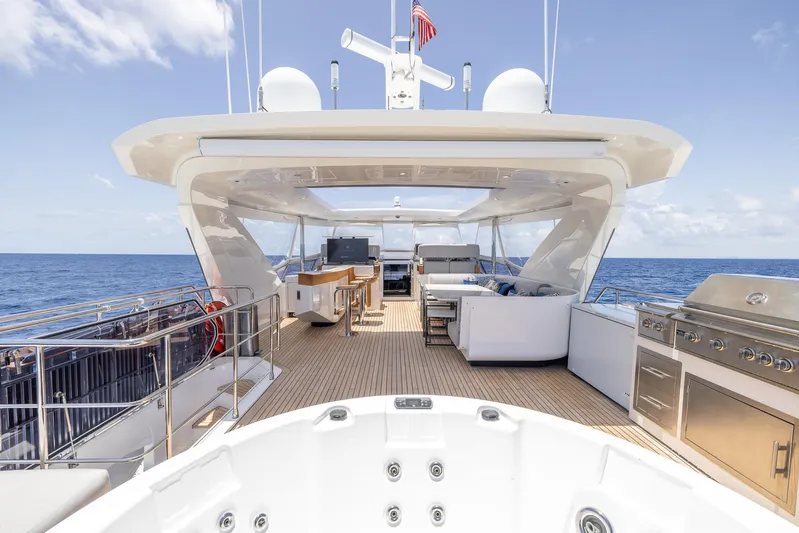 Captain Morgan II Yacht Photos Pics Luxurious 2021 Azimut Grande 27 METRI yacht deck with jacuzzi and ocean view.