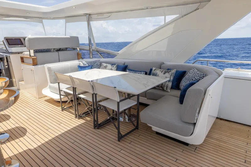 Captain Morgan II Yacht Photos Pics Luxurious Azimut Grande 27 METRI yacht deck with elegant seating and ocean view, 2021 model.