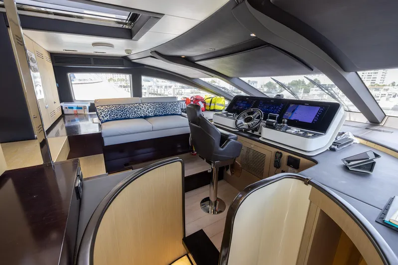 Captain Morgan II Yacht Photos Pics Luxurious interior of 2021 Azimut Grande 27 METRI yacht with modern helm and seating area.