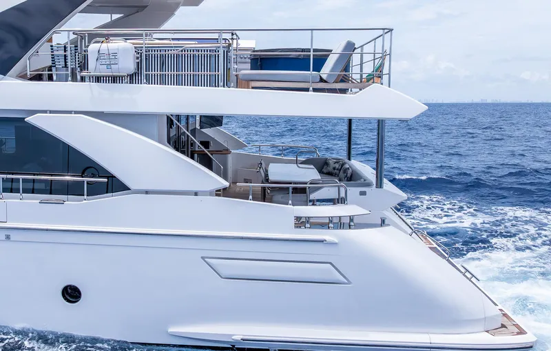 Captain Morgan II Yacht Photos Pics Azimut Grande 27 METRI 2021 yacht cruising on open sea, showcasing luxury design.