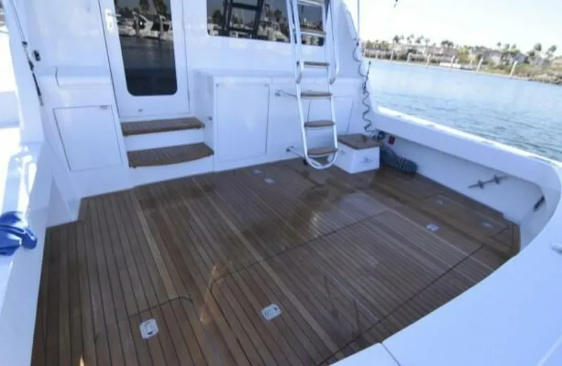 Burnin Daylight Yacht Photos Pics Hatteras 50 Convertible 2006 yacht deck with wooden flooring and ladder.