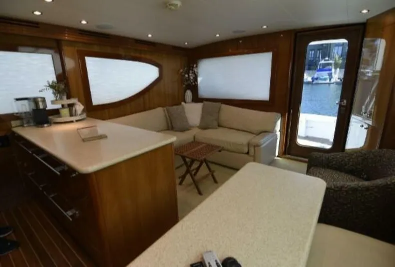 Burnin Daylight Yacht Photos Pics Luxurious interior of 2006 Hatteras 50 Convertible yacht with modern furnishings.