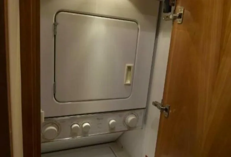 Burnin Daylight Yacht Photos Pics Stacked washer and dryer in 2006 Hatteras 50 Convertible yacht.