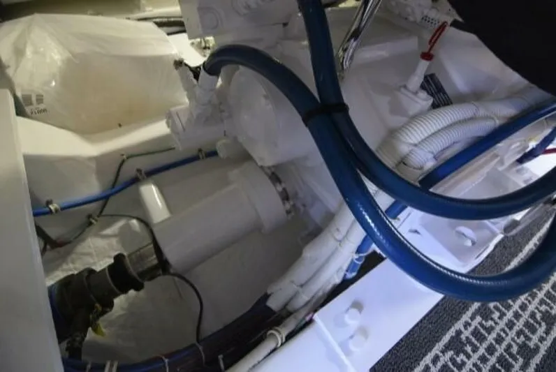 Burnin Daylight Yacht Photos Pics Engine room of 2006 Hatteras 50 Convertible with visible cables and components.