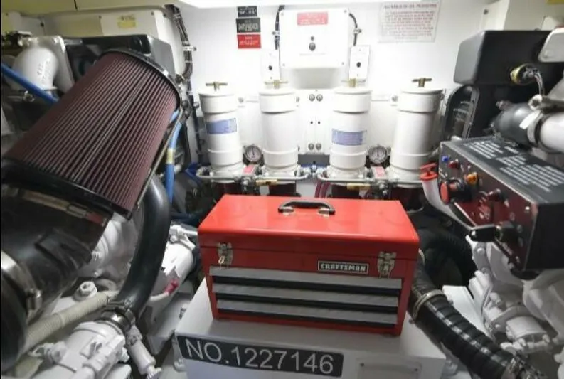 Burnin Daylight Yacht Photos Pics Engine room of 2006 Hatteras 50 Convertible with red toolbox and filters.