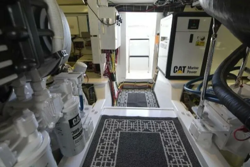 Burnin Daylight Yacht Photos Pics Engine room of 2006 Hatteras 50 Convertible yacht with CAT Marine Power equipment.