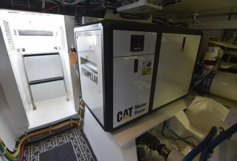 Burnin Daylight Yacht Photos Pics Caterpillar marine power generator in 2006 Hatteras 50 Convertible engine room.