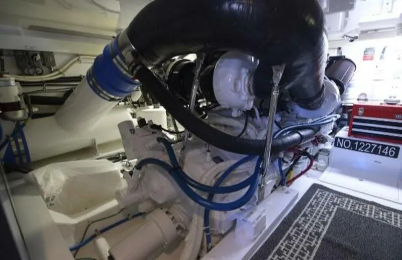 Burnin Daylight Yacht Photos Pics Engine room of 2006 Hatteras 50 Convertible yacht, showcasing machinery and components.