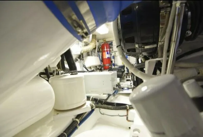 Burnin Daylight Yacht Photos Pics Engine room of 2006 Hatteras 50 Convertible yacht, showcasing mechanical components and systems.