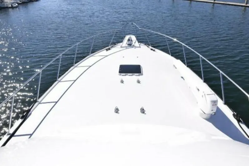 Burnin Daylight Yacht Photos Pics Hatteras 50 Convertible 2006 yacht bow view on water.