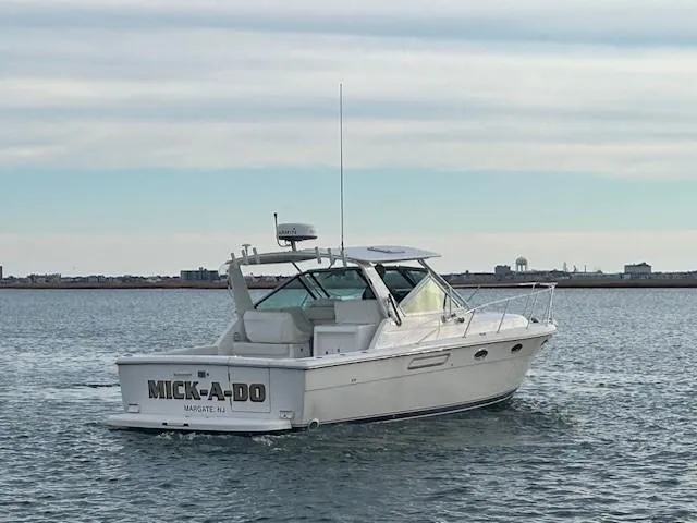 Mickadoo Yacht Photos Pics 2001 Tiara Yachts 3100 boat named "Mick-A-Do" on calm water.