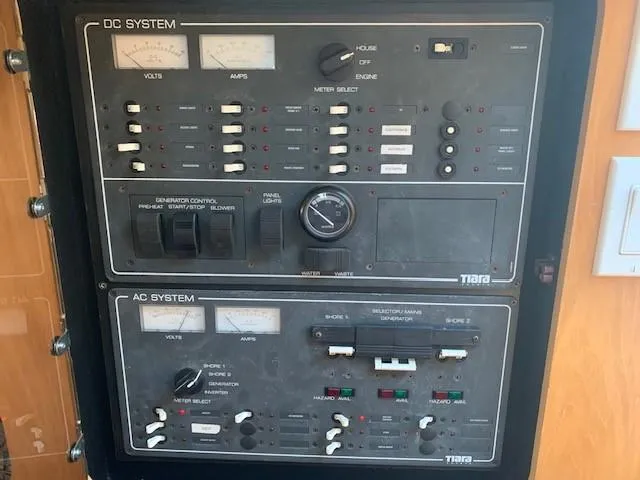 Mickadoo Yacht Photos Pics Electrical control panel of a 2001 Tiara Yachts 3100, featuring DC and AC systems.