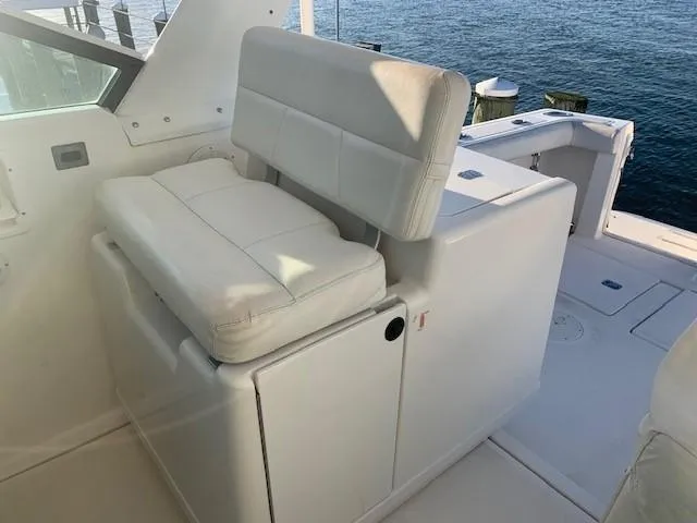 Mickadoo Yacht Photos Pics White seating on 2001 Tiara Yachts 3100, overlooking water.
