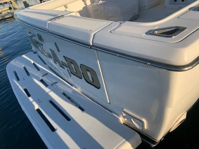 Mickadoo Yacht Photos Pics 2001 Tiara Yachts 3100 boat stern view with swim platform on water.